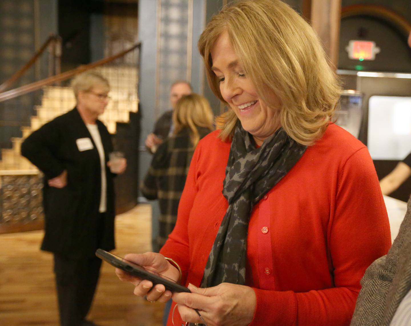 Liz Bishop, the Republican nominee for the Illinois State House District 76 seat smiles while looking at results during  Election night on Tuesday, Nov. 5, 2024 at the Auditorium Ballroom in La Salle.