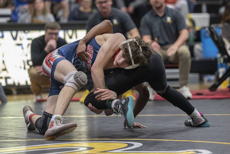 Morrison’s Patrick Schaefer grapples with Riverdale’s Jay Orr in the 138 pound finals Saturday, Jan. 31, 2026, during the Class 1A Wrestling Regionals at Riverdale High School. Schaefer won 19-12.