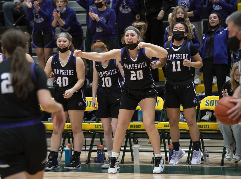 Hampshire's Chloe Van Horn, from left, Jaden Szymonik, Sydney Hedderich and Claudia Kuk cheer their team during their win against Crystal Lake South on Friday, January 14, 2022 at Crystal Lake South High School.