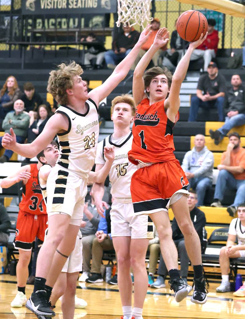 Sandwich's Sammy Legget tries to shoot around Sycamore's Lucas Winburn during their game Tuesday, Jan. 17, 2023, at Sycamore High School.