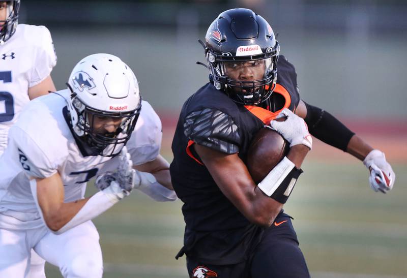 DeKalb’s Davon Grant breaks away from Plainfield South's Caden Pierceall on his way to the end zone for a long touchdown catch during their game Friday, Sept. 1, 2023, at DeKalb High School.