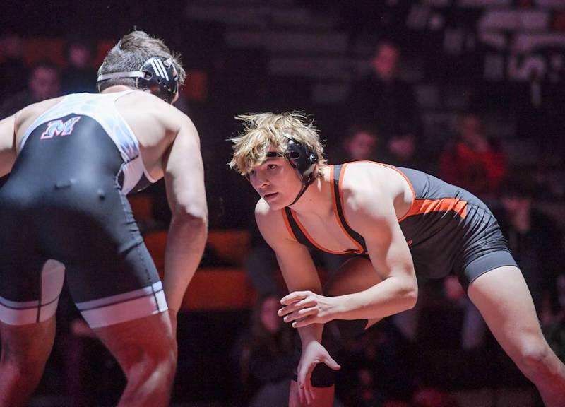 Marian Central's Max Astacio and St. Charles East's Gavin Connolly wrestle at 165 pounds during a match in St. Charles on Wednesday, December 20, 2023.