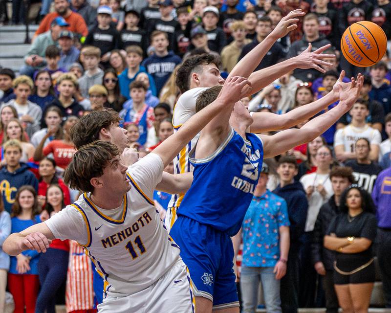 Newman and Mendota players reach for rebound on Friday, January 30, 2026 at Mendota High School in Mendota.