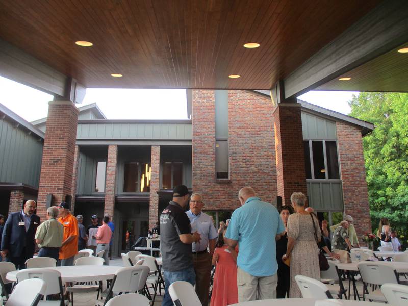 Party guests mingle under the roof of the new pavilion at the Pickerill Estate House on July 15, 2023.