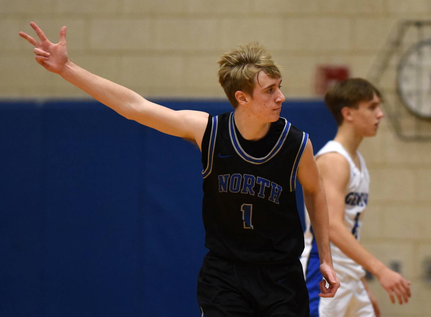 Joe Lewnard/jlewnard@dailyherald.com
St. Charles North’s Tyler Settelmyer celebrates after hitting a three-point shot during Saturday’s game at Geneva.