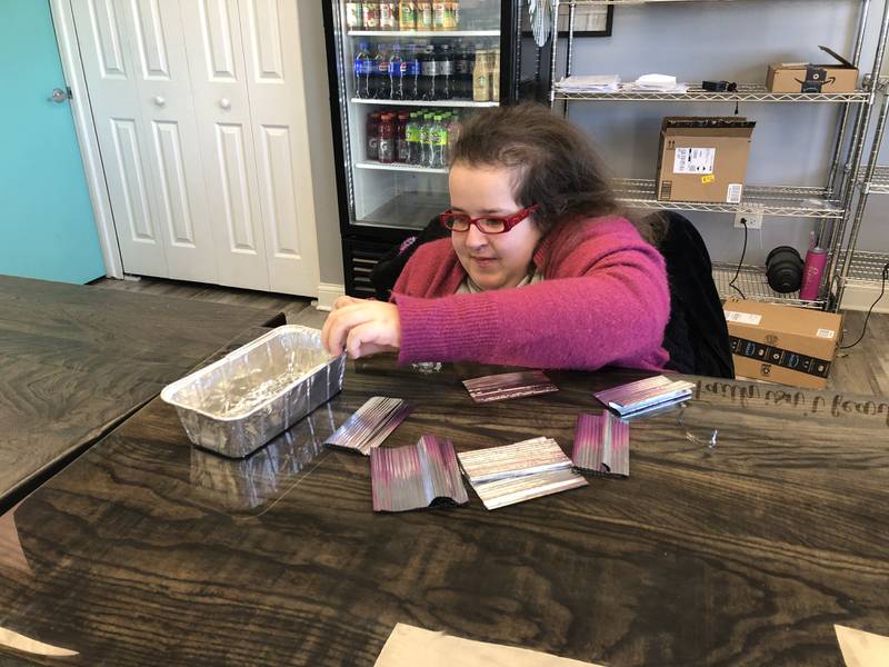 Teagan Haniszewski pulls apart twist ties at Blessed Little Kitchen in Huntley