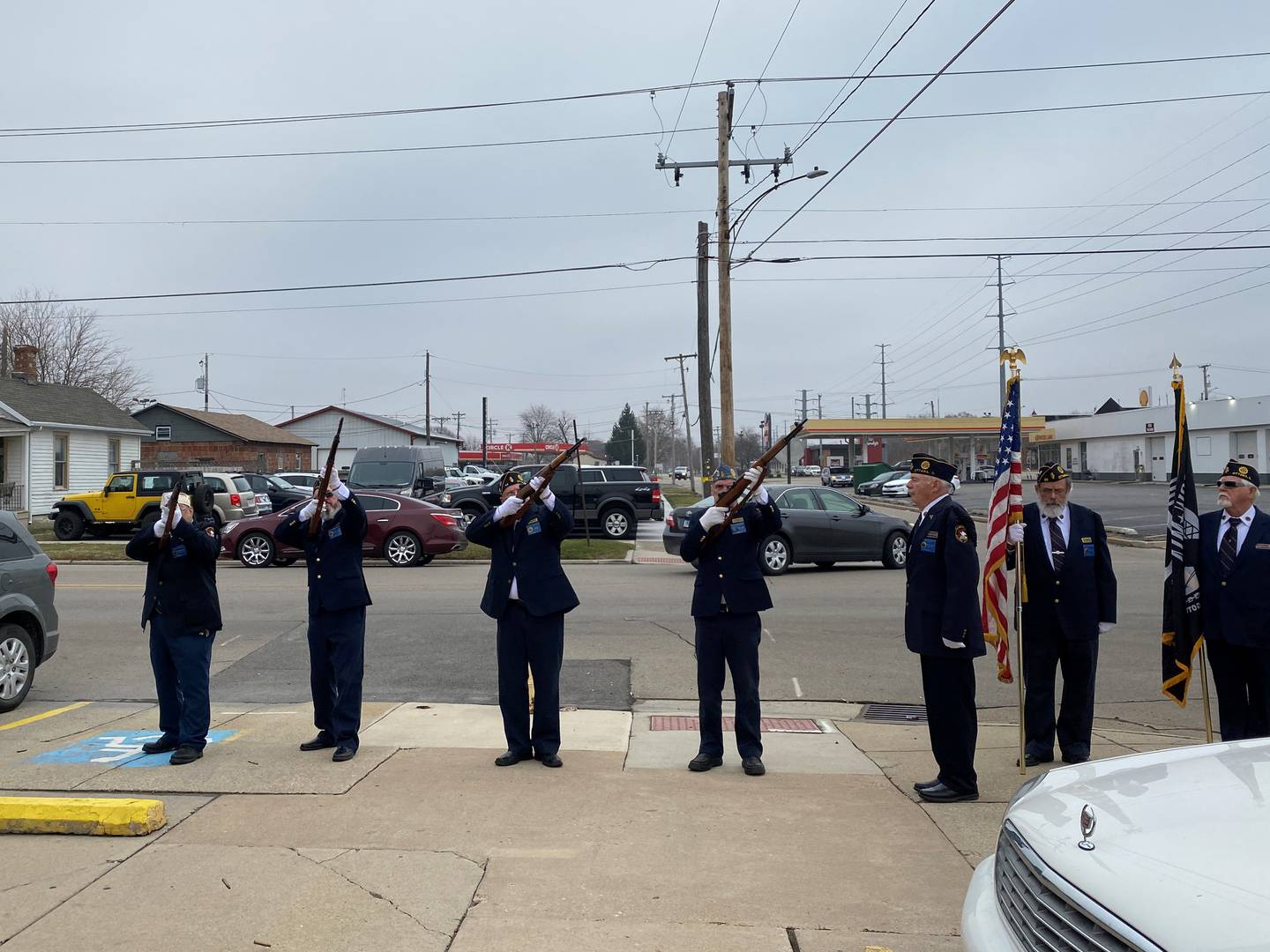 The American Legion Honor Guard fires rifles at the Ottawa VFW Wednesday morning.