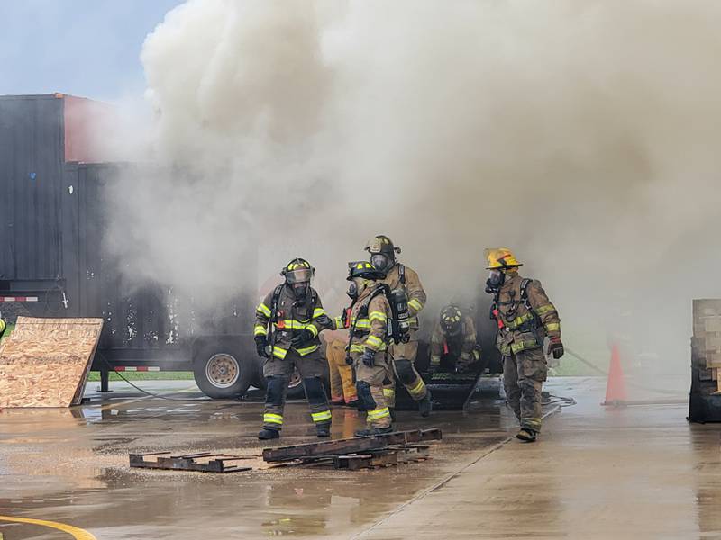 Firefighter training on Saturday included four separate burns. During each one, about 10 firefighters worked as a team on the situation.