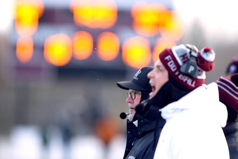 Prairie Ridge’s head coach Chris Schremp and his staff monitor the action against St. Ignatius in Class 6A football playoff semifinal action at Crystal Lake on Saturday.