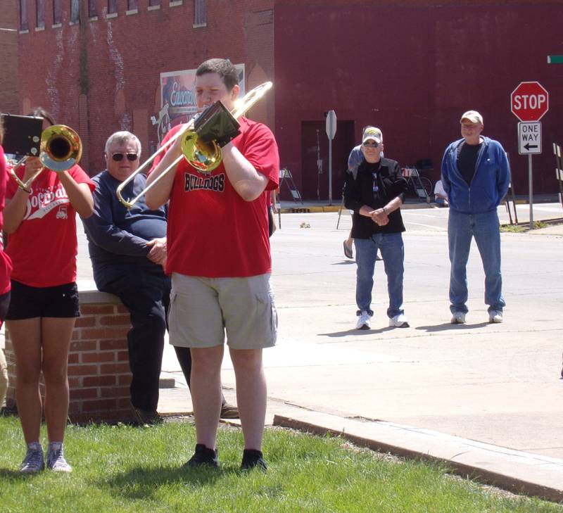 A Streator High School band member performs "The Battle Hymn of the Republic" on their trombone Monday, May 27, 2024, during the Memorial Day ceremony at Veterans Memorial Plaza in Streator's City Park.