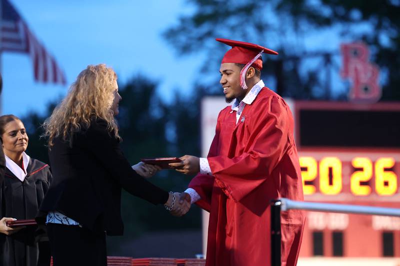 Graduate Donovan Prude smiles as he receives his diploma during the Bradley-Bourbonnais Community High School commencement ceremony on Thursday, May 21, 2026.