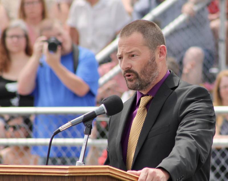 Brandon Rogers, vice president of the board of education, speaks prior to the presentation of the diplomas on Sunday, May 28, 2023, at the Dixon High School graduation.