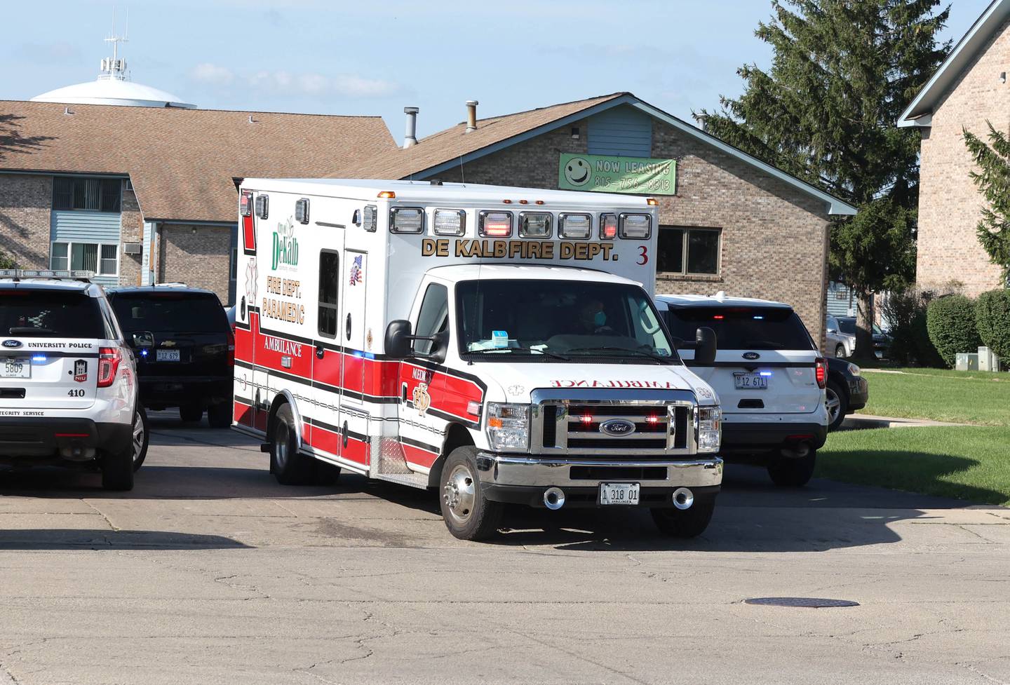 A DeKalb Fire Department ambulance leaves the scene of a shooting Wednesday, Aug. 24, 2022, at West Ridge Apartments in DeKalb.