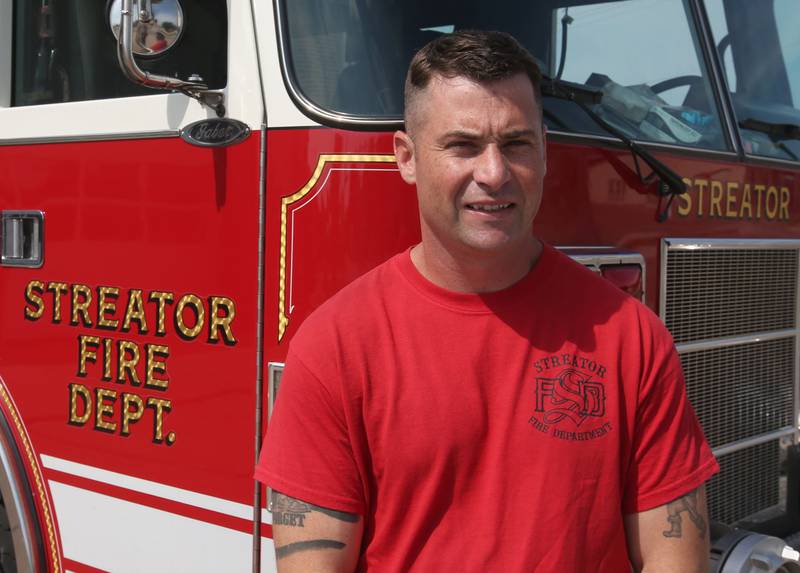 Streator firefighter and Veteran Ed Levy poses for a photo next to a fire truck on Wednesday, Sept. 18, 2024 at the Streator Fire Station.