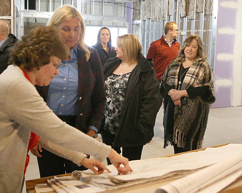 Lighted Way Executive Director Jessica Kreiser and State Sen. Sue Rezin (R-Morris) look at blueprints of the new facility located at 1445 Chartres Street on Monday, Jan. 23, 2023 in La Salle. Lighted Way will move from a 10,000-square-foot center to a 33,000-square-foot center and will allow better programming and more activities.