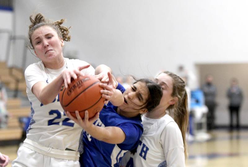 St. Charles North’s Katrina Stack (left) and Wheaton North’s Sara Abdul (right) go after a rebound during the Class 4A St. Charles North Regional final on Thursday, Feb. 16, 2023.