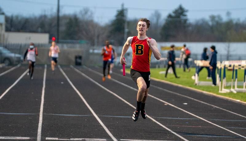 Batavia’s Weston White helps his team finish first in the 4x200 meter relay during the Roger Wilcox Track and Field Invitational at Oswego High School on Friday, April 29, 2022.