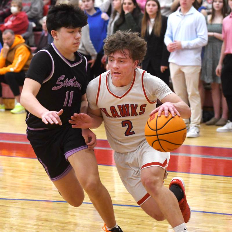 Oregon's Cooper Johnson (2) drives to the basket as Rockford Lutheran's Evan Krull defends on Friday, Feb. 6, 2026 at the Blackhawk Center.