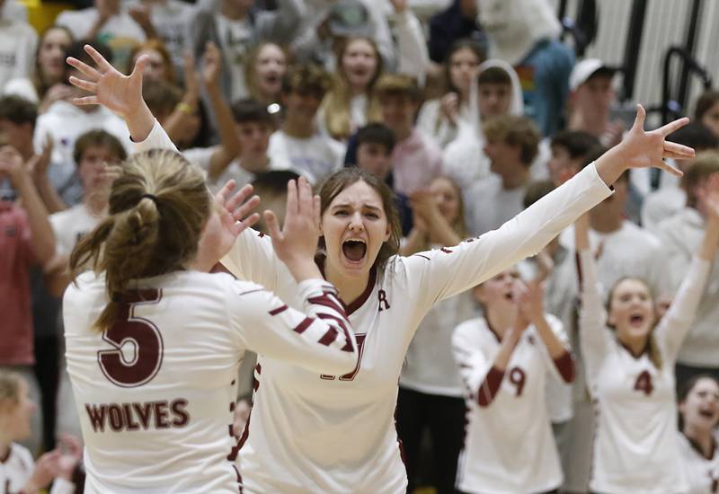Prairie Ridge's Grace Jansen, left, and her teammate, Prairie Ridge's Mackenzie Schmidt, celebrate a point during a IHSA Class 3A regional volleyball match Thursday, Oct. 27, 2022, between Prairie Ridge and Crystal Lake Central at Crystal Lake South High School.