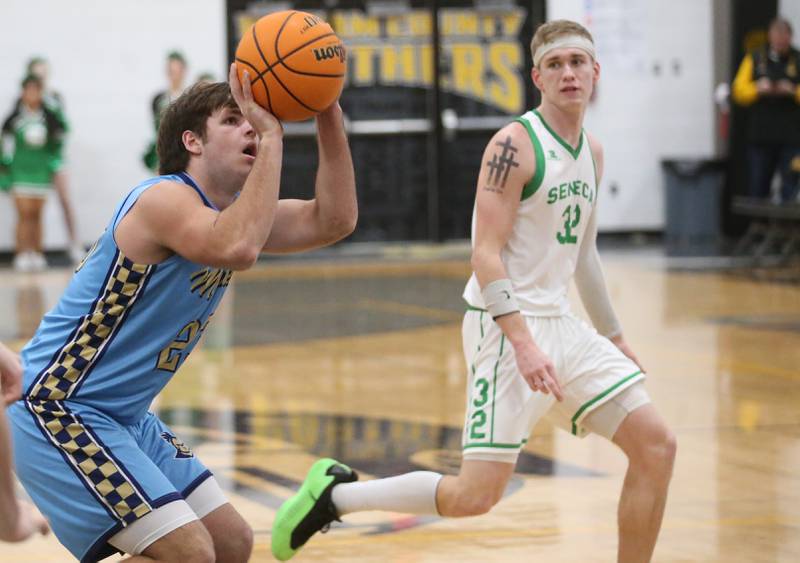 Marquette's Matt Graham shoots a jump shot over Seneca's Paxton Giertz during the Tri-County Conference championship on Friday, Jan. 31, 2025 at Putnam County High School.