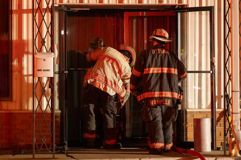 Firefighters enter building involved in structure fire on Thursday, July 17, 2025 on 1504 Poplar St. in Ottawa.