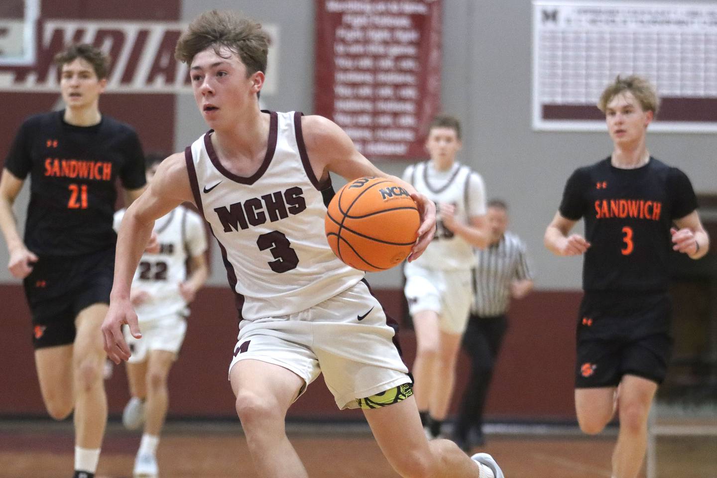 Marengo’s Caden Bezik leads a fast break against Sandwich in varsity boys basketball action on Saturday, Jan..24, 2025, at Marengo High School in Marengo.