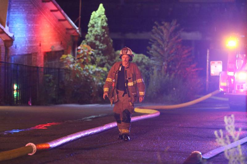 Spring Valley Fire Chief Todd Bogatitus walks up Walnut Street behind Westclox on Friday, July 14, 2023 in Peru.