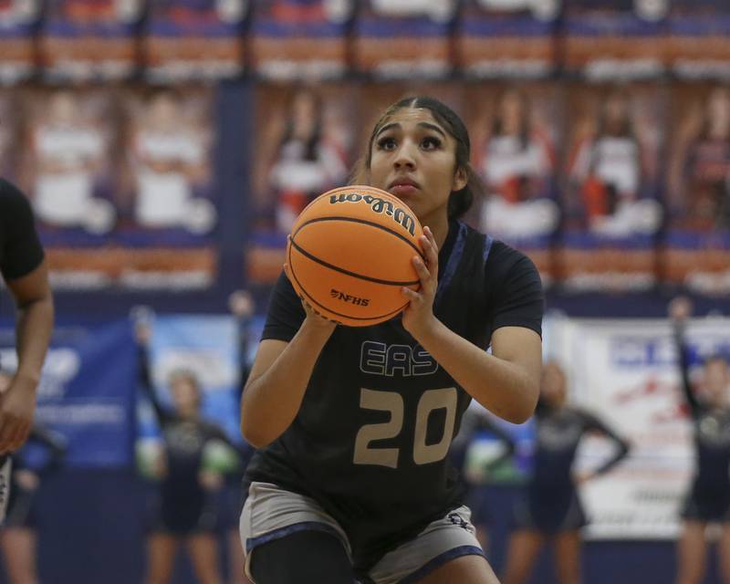 Oswego East's Ja'liyah Shepard (20) shoots a free throw during their basketball game between Oswego East at Oswego Friday, Jan 09, 2026 in Oswego.