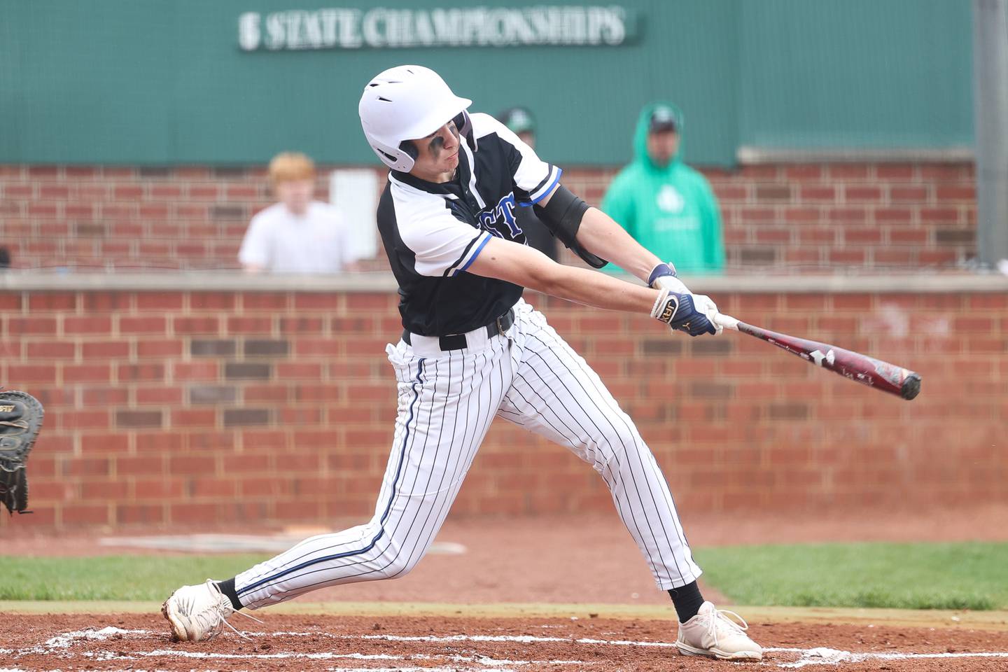 Lincoln-Way East’s Trevor Fishman drives in a run to give the Griffins a 2-0 lead in the first against Providence on Saturday, May 6, 2023, in New Lenox.