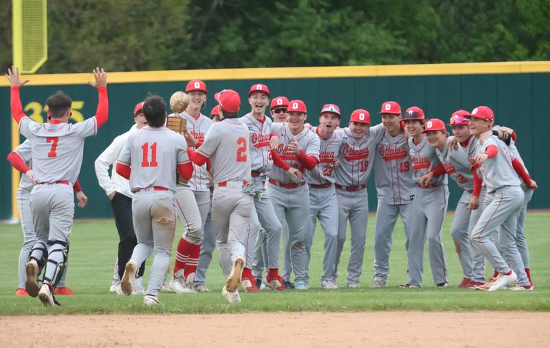 Members of the Ottawa Pirates react as they hoist the Illinois River Rivalry trophy after defeating L-P on Thursday, April 30, 2026 at Huby Sarver Field in the L-P Athletic Complex in La Salle.
