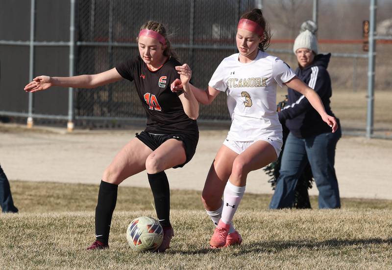 Plainfield East's Violet Meija and Sycamore's Marin Gautcher fight for possession during their game Tuesday, March 25, 2025, in the Barb Fest tournament at DeKalb High School.