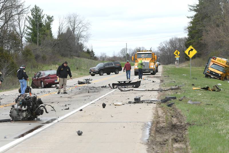 Police work on reconstructing a 3-vehilce collision on Illinois Route 2 between Oregon and Byron on Monday afternoon. Seven people were injured in the accident and one fatality was being reported. No students were onboard the Illinois Central School bus, but the driver and two aides were injured in the accident Illinois Central officials said. The road remained closed from Town Hall Road to Camling Road as officers remained on the scene.