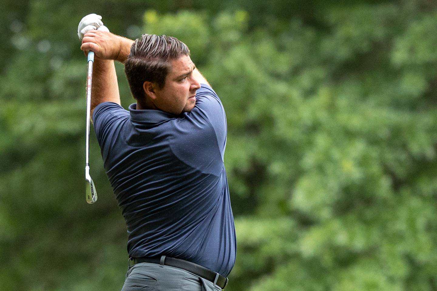 Huston Gass swings his 8-iron at the 45th Richard J. Berry Memorial on Sunday, July 13, 2025, at the Eastwood in Streator.