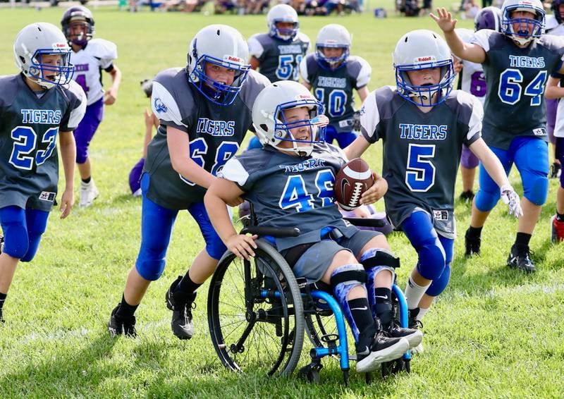 Team manager Zane Britton, who is afflicted with spina bifida, scored a touchdown for the Princeton fifth grade youth football team against Dixon. For good measure, he added the conversion run, also.