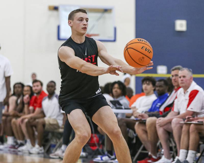 Glenbard East's Michael Nee (4) passes for an assist in their Riverside-Brookfield Shootout basketball game.  June 20, 2025 in Riverside.