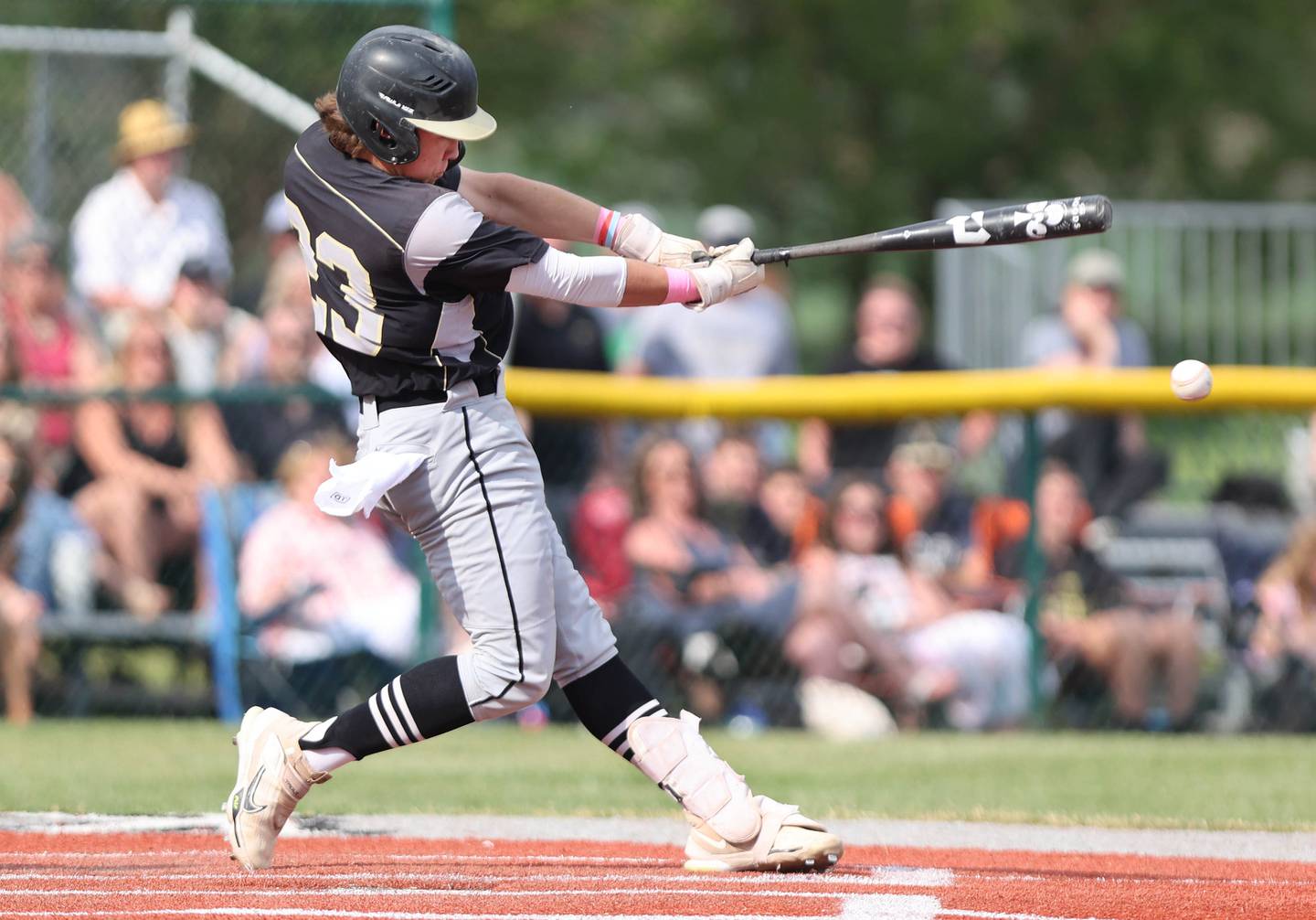 Sycamore's Kyle Hartmann puts a ball in play during their Class 3A regional semifinal against St. Francis Thursday, June 1, 2023, at Kaneland High School in Maple Park.