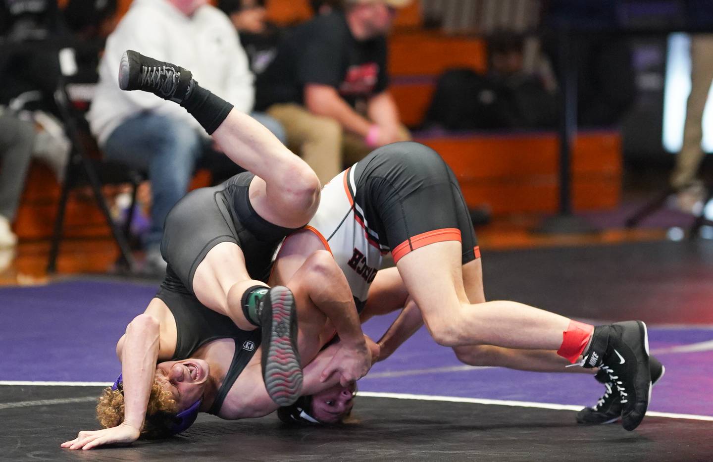 Sandwich’s Miles Corder (right) competes in a 144 pound championship match against Dixon’s Jayden Weidman during the Reaper Classic Wrestling meet at Plano High School on Saturday, Dec 9, 2023.