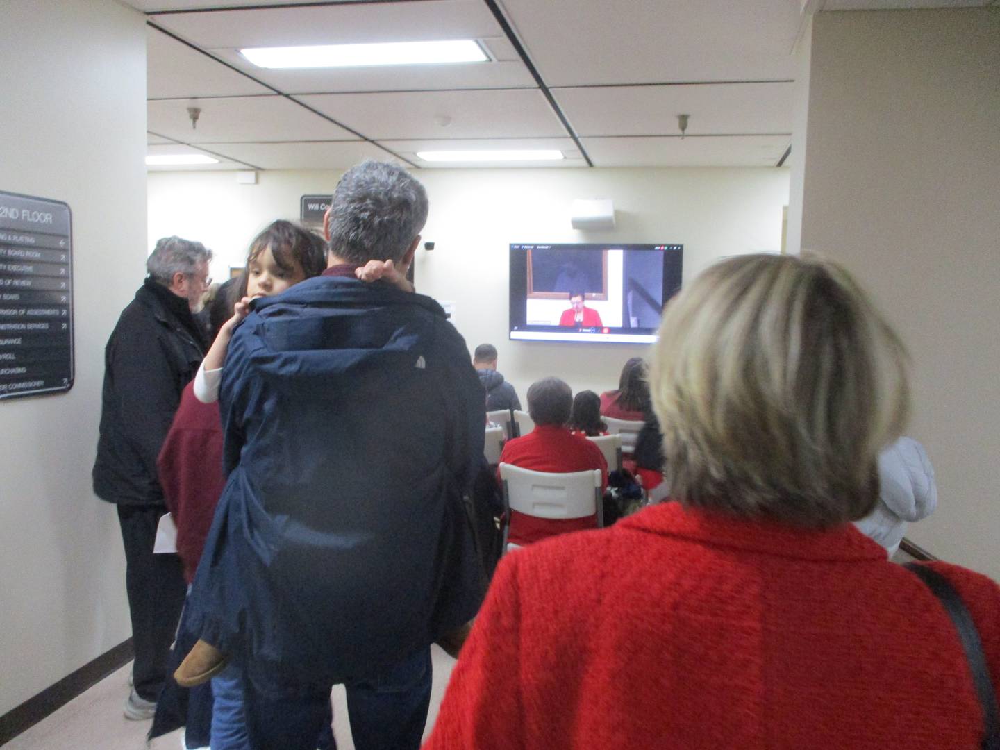 Quarry opponents stand outside a packed overflow room to view proceedings at a Will County Board meeting on Thursday, when the main topic was a quarry expansion that faced intense residential opposition.