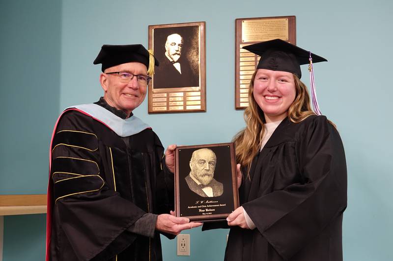 Illinois Valley Community College President Jerry Corcoran awards Hope Beelman, of Peru, the 2022 F.W. Matthiessen Award.