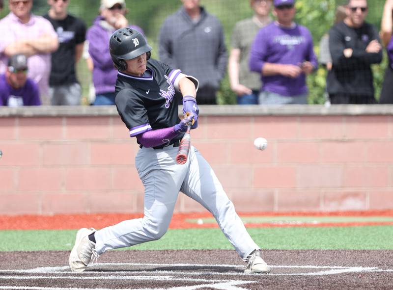Downers Grove North's Brooks Barofsky (20) is about to make contact with the ball during the IHSA Class 4A baseball regional final between Downers Grove North and Hinsdale Central at Bolingbrook High School on Saturday, May 27, 2023.