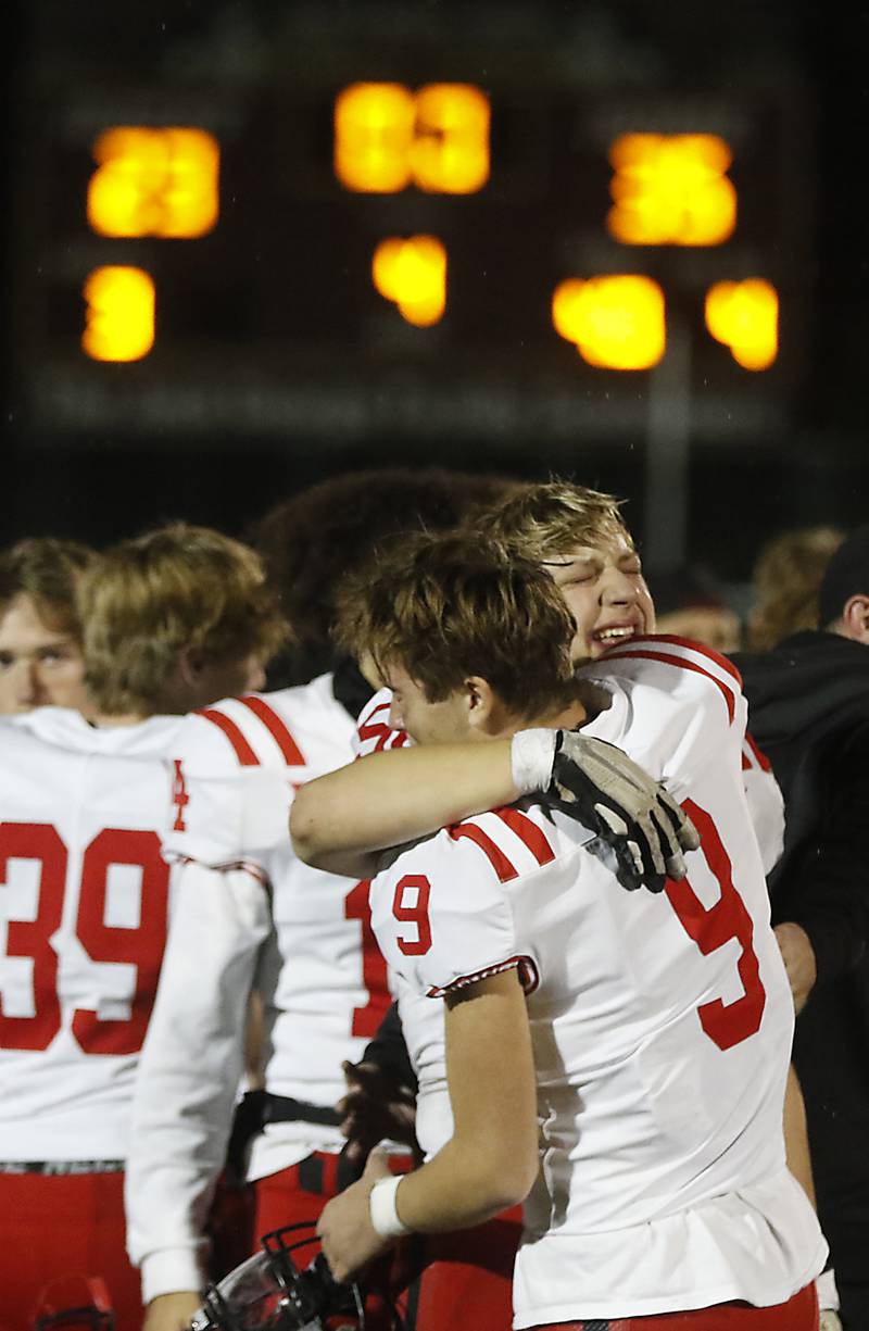 Huntley's Ben Cohen (right) hugs his teammates, Landen Crisp after Huntley was defeated by St. Ignatius in a IHSA Class 8A second round playoff football game on Friday, Nov. 3, 2023, at St. Ignatius College Prep in Chicago.