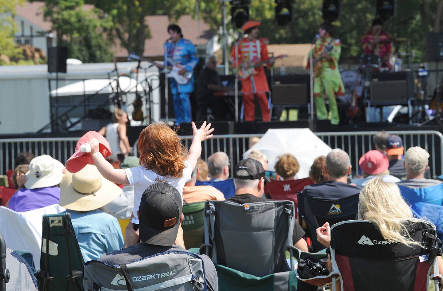 A large crowd enjoys the Beetles cover band American English on the main stage at Hometown Days on Sunday, Sept. 1, 2024, at Beecher Park in Yorkville.