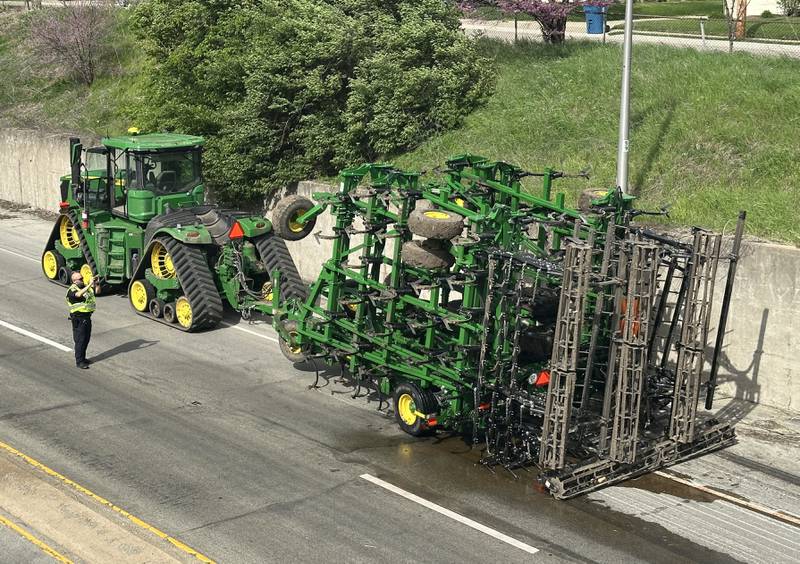 Peru Police work the scene of a tractor and tandem disk that leaked hydraulic fluid on the shoulder of Illinois Route 251 and 7th Street overpass on Monday, April 28, 2025. Peru Fire, Illinois Department of Transportation and Peru police responded to the incident.