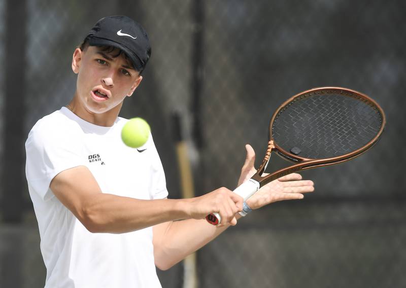 Downers Grove South’s Ryan Roumenov returns the ball during the boys state tennis tournament at Barrington High School Thursday, May 29, 2025.