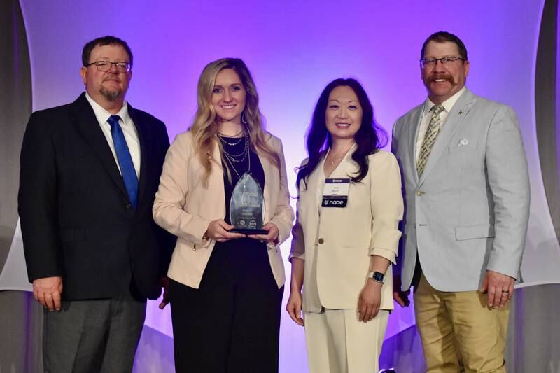 (From left) Jeff Voris, National Association of Agricultural Educators, Region IV vice president; educator Caseelynn Shimmin, Bureau Valley CUSD 340; Mung Wang, of Bayer; Eric Tilleman, NAAE, 2023-2024 president pose for a photo after Shimmin was honored as one of six Outstanding Early Career Teacher Award recipients.
