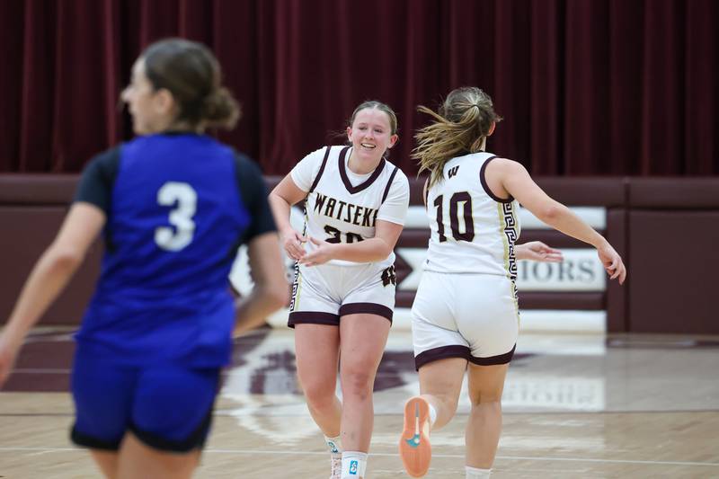 Watseka-Milford's Noelle Schroder is high-fived by teammate Christa Holohan after hitting a 3-pointer during the Warriors' 60-49 victory over Clifton Central on Saturday, Jan. 10, 2026.