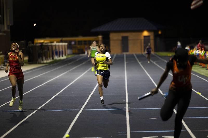 Sterling’s Taah Liberty eyes the finish line in the 4x200 Thursday, April 25, 2024 at the Sterling High School Night Relays.