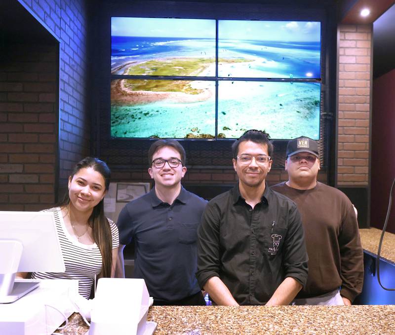 Emmanuel González, (second from right) owner of Provecho Home Made Food, with some of his staff Friday, May 22, 2026, at the restaurant. Provecho is a new Venezuelan homemade food restaurant that has recently opened at 131 East Lincoln Highway, in DeKalb.