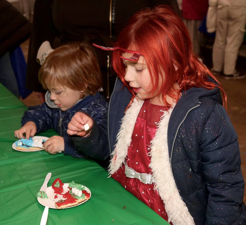 Oskar and Ophelia Drayer of Maple Park decorate cookies at the 2023 Elburn Christmas Stroll on Saturday, Dec. 2, 2023.