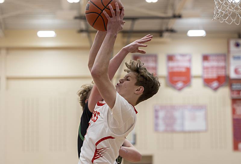 Oregon’s Tucker O’Brien hauls down a rebound against Rock Falls Tuesday, Dec. 12, 2023 in Oregon.